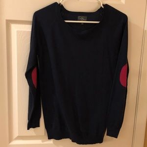 Small navy blue sweater with pink elbow patches